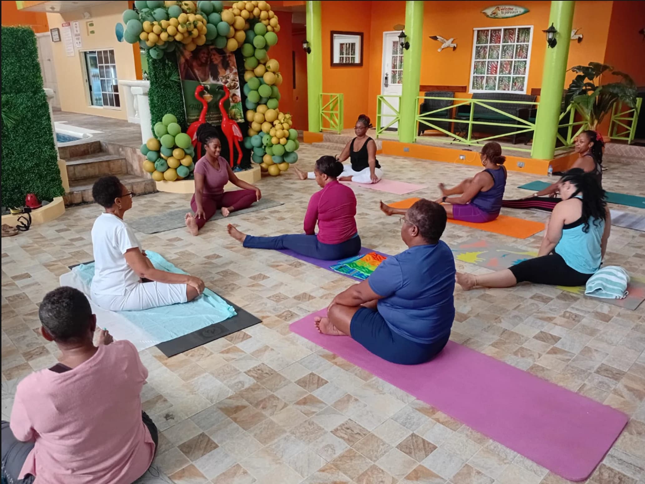 A Bassa Yoga class practicing on the outdoor patio in Barbados